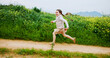 © peopleimages.com - Energy, excited and running with girl outdoor in countryside for child development or growth. Adventure, path and space with happy kid in green nature for activity, journey or wilderness experience