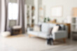 © Pixel-Shot - Modern interior of living room with stylish sofa, blurred view