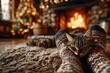© horizon - First-person view of feet in festive Christmas socks, propped on a rug before a roaring fire, with a decorated tree blurred in the background.