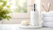 © pvl0707 - Elegant marble soap dispenser adorns a bright bathroom counter with fresh towels and toothbrushes in view