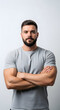 © SnapNshine - Confident muscular man posing with arms crossed a portrait of strength and self-assurance isolated o