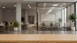 © Prathankarnpap - 3d render Wooden table with open space office interior skyscraper background