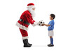 © Ljupco Smokovski - Santa Claus giving a football to a little boy