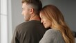 © Road Red Runner - A couple shares a warm hug in their inviting home, enjoying a quiet moment together