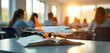 © Pete - Airplane model sits on book in classroom. Students attend lecture about aviation future, design. Education program aims to develop mechanical, aerospace engineering skills, advance tech innovation,