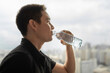 © kieferpix - Man Drinking Water from Bottle, Hydration and Healthy Lifestyle, Young Man Staying Hydrated, Wellness and Daily Self-Care