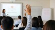 © Matheus - Active participation in an educational setting. A hand is up among a seated group of people, ready to contribute to the discussion.