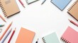 © Nahid - Colorful notebooks, pencils, and stationery elements on white