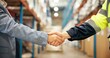 © Nina25/peopleimages.com - Business people, logistics or handshake with b2b in warehouse for partnership, deal or supply chain. Closeup, distributor or supplier shaking hands in aisle for shipping, distribution or wholesale