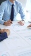 © rogerphoto - Business people team analyzing financial charts and graphs during corporate meeting, focusing on strategy development, data driven decision making
