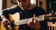 © NAIMAH - A close-up showcases a man's hands expertly playing a wooden acoustic guitar. Warm lighting illuminates his face with a soft, content expression. The focus is on the musical instrument