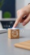 © ABDOU BERRI - Customer feedback and service quality – finger touching glowing smiley cube on desk with digital icons