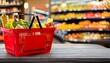 © Lilimanatasa - grocery store, shelves, a red shopping basket, and a blurry background