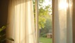 © Viktor - Morning sun shines through soft white window curtains, creating beautiful warm glow. Golden light fills home room, setting peaceful, comfortable atmosphere. Outside, green trees, garden visible from