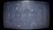 © Simon - Close-up photo of an old CRT monitor screen showing visible dust, fingerprints, and pixel noise. The curved display and analog texture create a nostalgic, glitchy aesthetic reminiscent of vintage tech