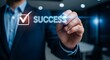 © Anggoro - Achieving Success: Businessman Drawing a Checkmark and the Word Success