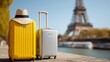 © Dzmitry - Two suitcases, one yellow and the other silver, with a traveling hat against the backdrop of the Eiffel Tower.Generative AI