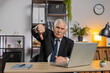 © Andrii Iemelianenko - Dislike. Upset senior businessman working on laptop at home office thumbs down sign gesture, expressing discontent, disapproval, dissatisfied bad work. Displeased serious freelancer grandpa in suit.
