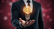 © si9nzation - Businessman holds glowing lightbulb representing innovative idea creative thinking success and imagination in a modern business environment