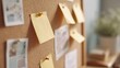 © CYBERPINK - Cork bulletin board with several yellow sticky notes pinned to it. the notes are of different sizes and shapes, and they are arranged in a scattered manner.