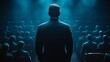 © Dmitry - A powerful moment unfolds as a distinguished speaker commands attention from an entranced audience in a dramatic venue