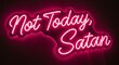© Kom - A vibrant neon sign displays the message 'Not Today, Satan' in bright pink cursive letters against a dark background, creating a bold and eye-catching visual statement