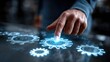 © keks20034 - A businessman adjusts glowing holographic gears, symbolizing automation, teamwork, and advanced technology in modern industry