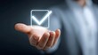 © pkproject - An open palm displays a luminous futuristic digital checkbox with a checkmark symbolizing validation successful completion and positive decision making in a technological context