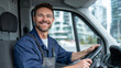© Maksym - Confident delivery driver posing inside a commercial van, hands steady on the steering wheel, city buildings visible through the windows