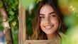 © savittree - Smiling woman framed by greenery in a natural outdoor setting showcasing happiness and connection with nature