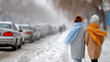 ©  VladaToday - Two women in warm coats and scarves walking together on snowy city street between parked cars. Winter friendship and everyday life..