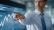 © forenna - Close-up of director pointing to declining data graph on holographic display — representing real-time leadership, crisis communication, executive problem-solving, and the emotional strain of