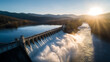 © iPhoto - Aerial view of hydroelectric dam and reservoir landscape at sunrise