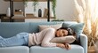 © AS Studio - Relaxing on the Couch A Woman's Peaceful Nap in a Cozy Living Room Setting