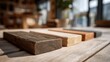 © Taba - Wooden sample blocks on rustic wood, blurred background, natural light