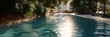 © Iryna - Tranquil poolside retreat with sunlight reflection and lush greenery