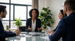 © Lari - Black woman executive leading corporate team meeting in modern office