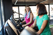 © BalanceFormCreative - Two friends are running side by side on treadmills, keeping each other motivated. Their workout feels energetic and focused as they stay in rhythm together.