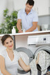 © auremar - happy housewife woman in laundry room
