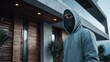 © Di Studio - A masked thief in balaclava and the door of a modern house in the background