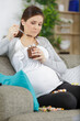 © auremar - beautiful pregnant woman eating chocolate