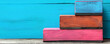 © HISTOCK - Colorful wooden steps representing business progress, growth, and career development