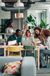© Zamrznuti tonovi - Diverse business team collaborating in modern office space