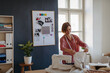 © Halfpoint - Female fashion designer starting her own small sewing business.