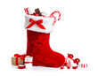 © Diana - A vibrant Christmas stocking overflowing with candy and gifts, isolated
