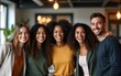 © Maria - Portrait of excited funny multi-ethnic staff people business team stand in office looking at camera. Happy diverse professional colleagues group celebrate success win victory reward at corporate party