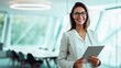 © Khawla - Confident Businesswoman Holding Tablet in Modern Office