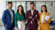 © PRASANNAPIX - Diverse Business Professionals Smiling Confidently in a Modern Office