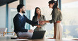 © BuyOutFelix04/peopleimages.com - Office, business people and handshake with team for welcome, greeting or introduction. Collaboration, shaking hands and happy workers in meeting for negotiation, b2b deal or thank you for partnership