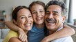 © Rony - Happy Family Hugging and Smiling Together at Home